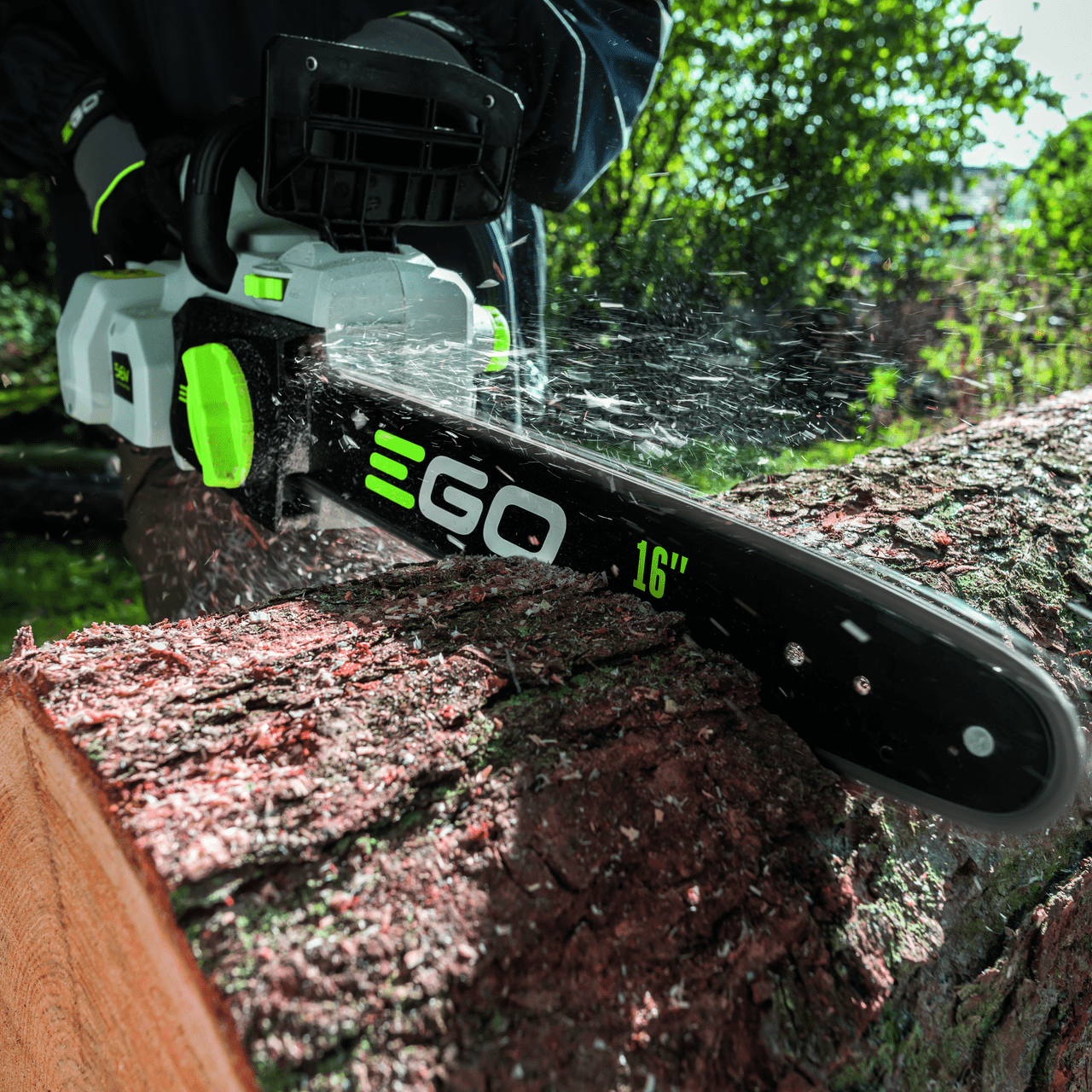 EGO Chainsaw saws through log